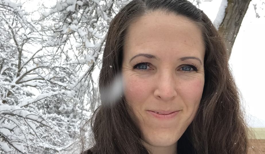 Woman in snowy forest