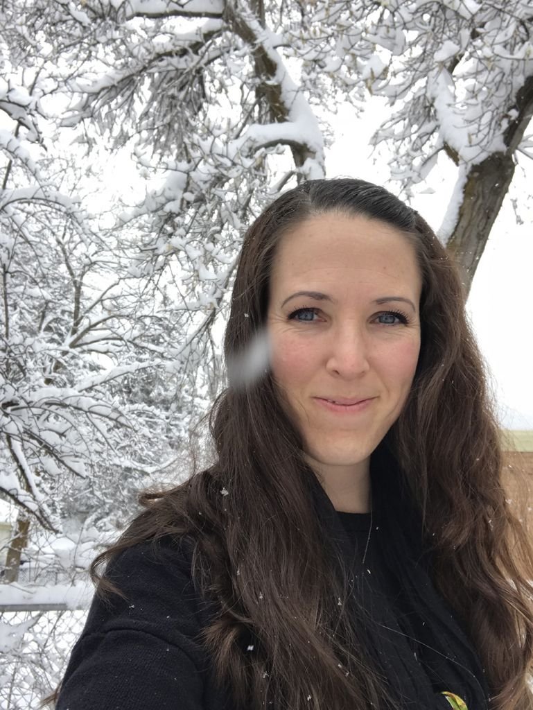 Woman smiling in snowy forest