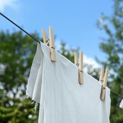 White towels hanging from clothesline