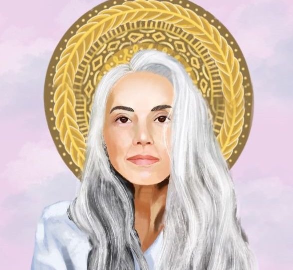 White woman with grey hair and golden halo looking directly at the viewer