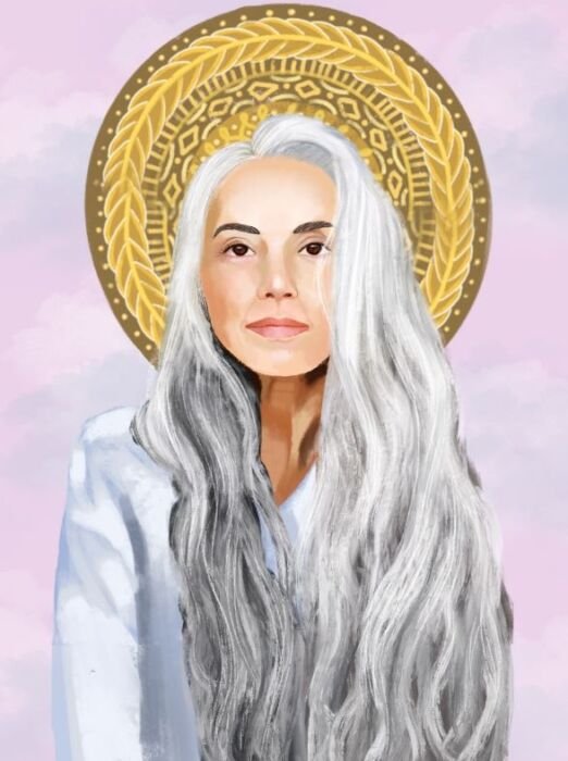 White woman with long gray hair and golden halo