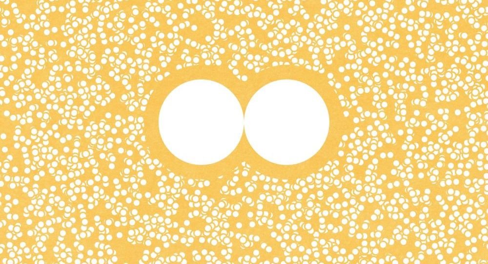 Two white circles surrounded by many tiny circles on a yellow background