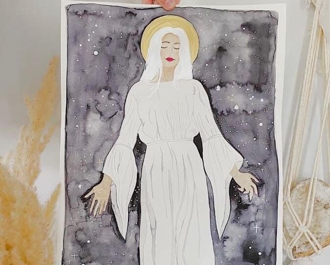 Woman dressed in white with outstretched arms